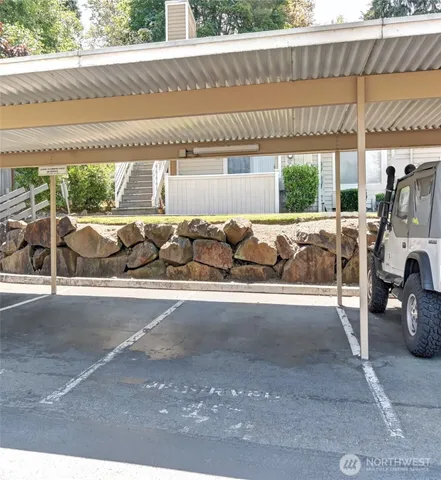 a living room with a couch and chairs