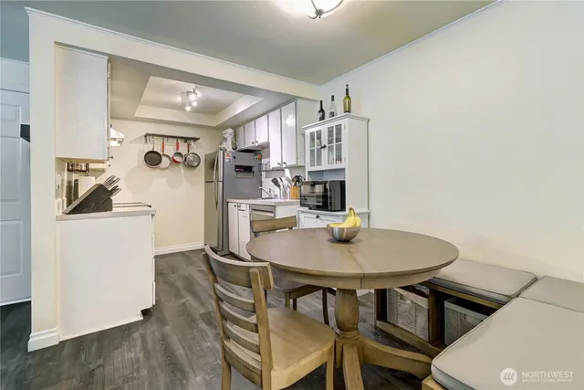 a kitchen with a table and chairs