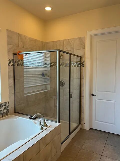 10820 Natches Trace Austin, TX 78717 - Photo 4 of 6 a bathroom with a tub and a shower