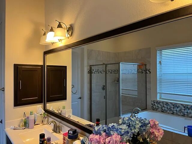 10820 Natches Trace Austin, TX 78717 - Photo 6 of 6 a bathroom with a sink and a mirror