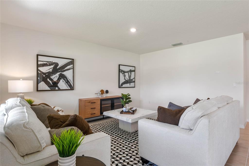 3503 Nettle Loop Tavares, FL 32778 - Photo 22 of 38 a living room with furniture and window