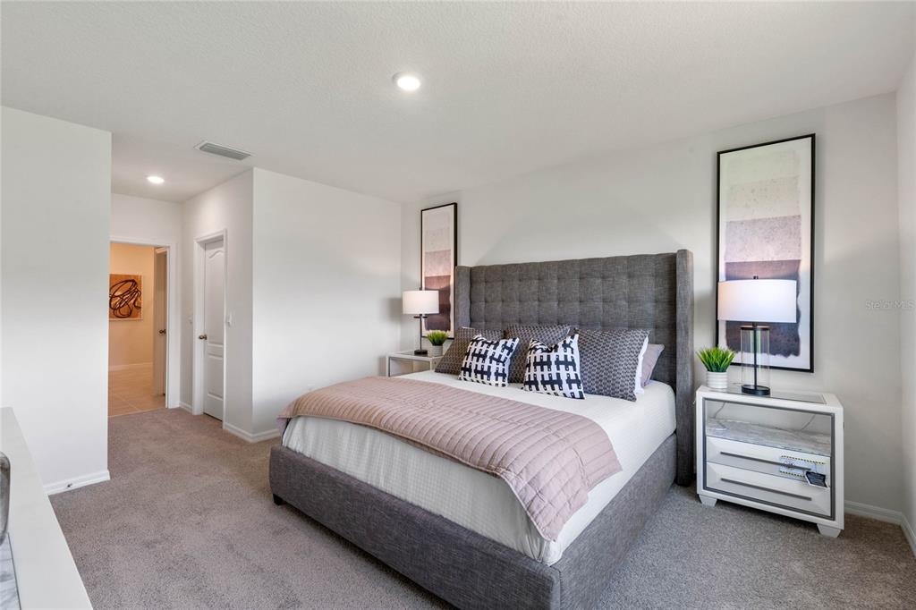 3503 Nettle Loop Tavares, FL 32778 - Photo 25 of 38 a bedroom with a bed and a couch