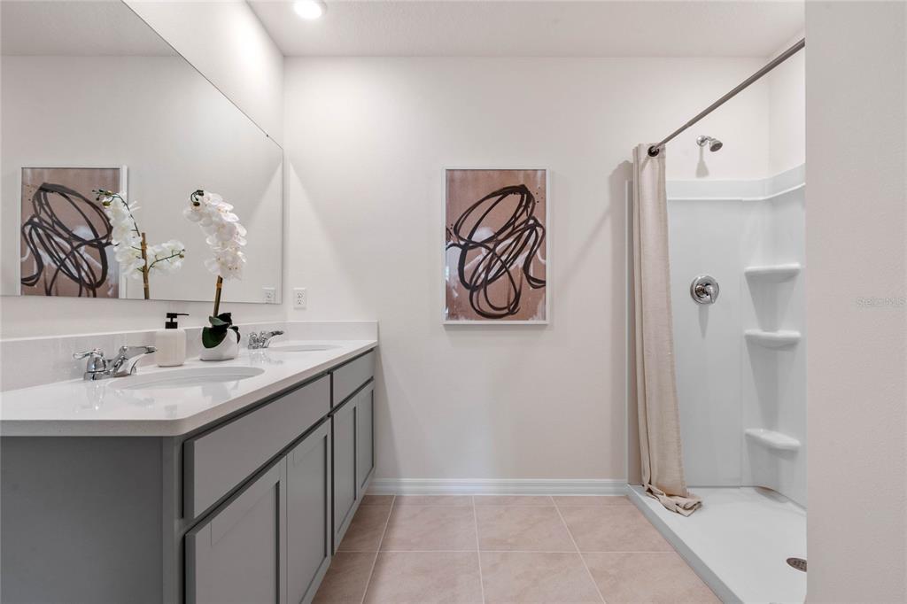 3503 Nettle Loop Tavares, FL 32778 - Photo 28 of 38 a bathroom with a sink and a mirror