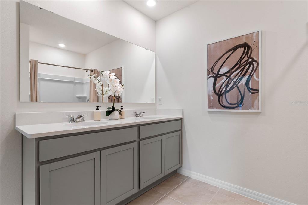 3503 Nettle Loop Tavares, FL 32778 - Photo 29 of 38 a bathroom with a sink and a mirror