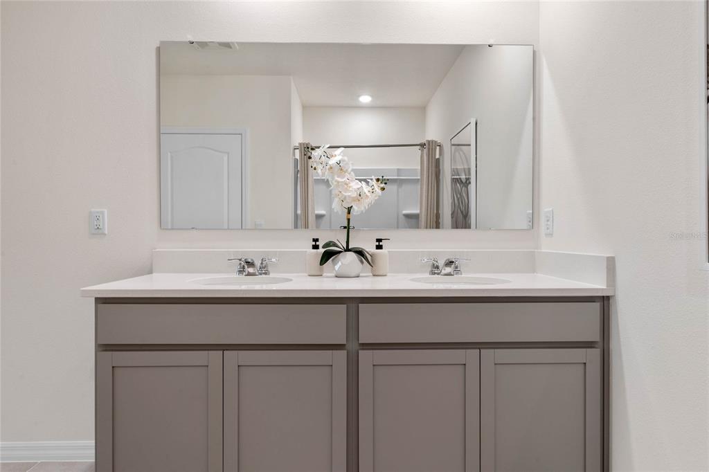 3503 Nettle Loop Tavares, FL 32778 - Photo 30 of 38 a bathroom with a sink and a mirror