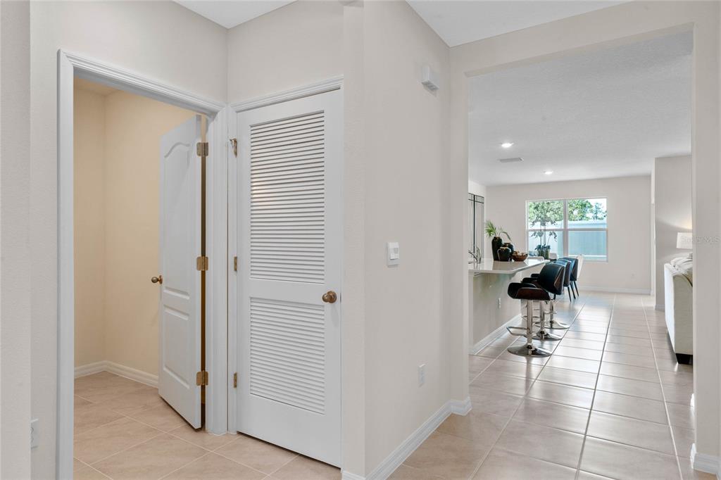 3503 Nettle Loop Tavares, FL 32778 - Photo 7 of 38 a view of a hallway view with living room and dining room