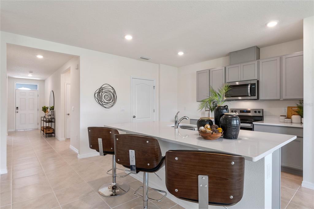 3503 Nettle Loop Tavares, FL 32778 - Photo 10 of 38 a kitchen with a sink cabinets and window