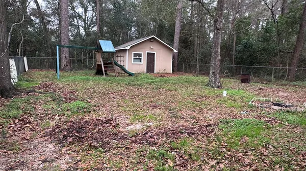 a backyard of a house with lots of green space