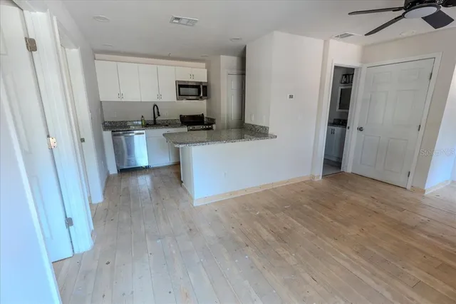 a view of kitchen with wooden floor