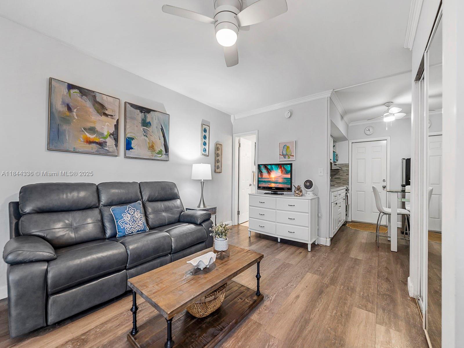 555 North Riverside Drive, Unit 4 Pompano Beach, FL 33062 - Photo 6 of 22 a living room with furniture and a flat screen tv