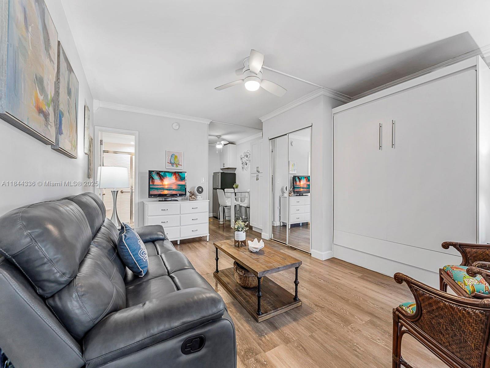 555 North Riverside Drive, Unit 4 Pompano Beach, FL 33062 - Photo 7 of 22 a living room with furniture and a wooden floor