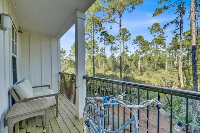 a view of a balcony with furniture