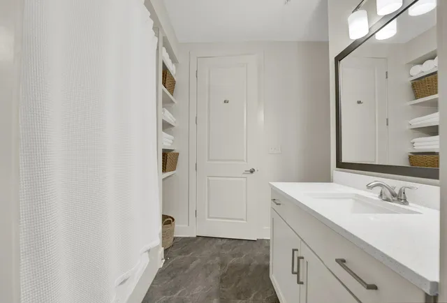 a bathroom with a sink and a mirror