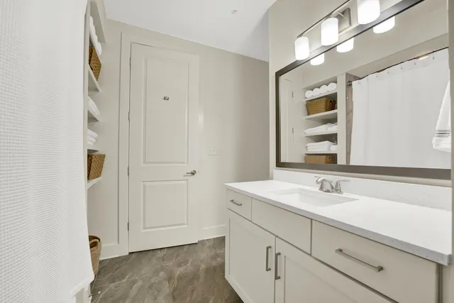 a bathroom with a sink and a mirror