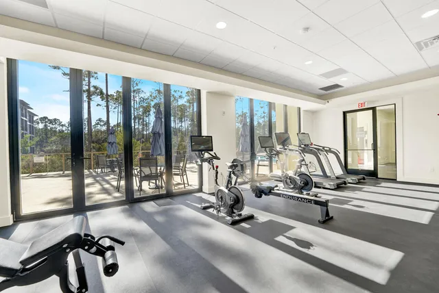 a room with gym equipment and a large window