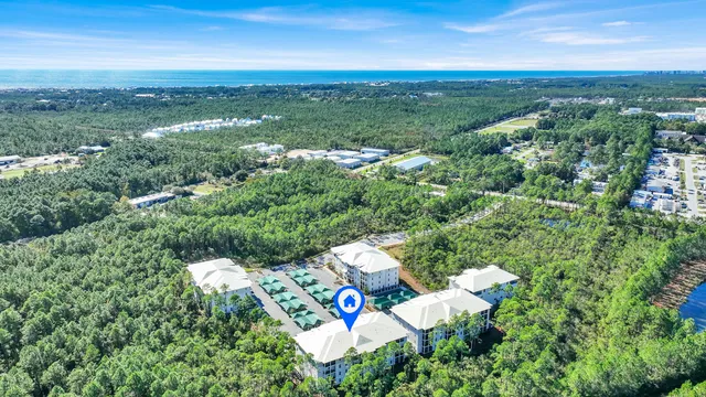 a view of swimming pool with outdoor seating and plants