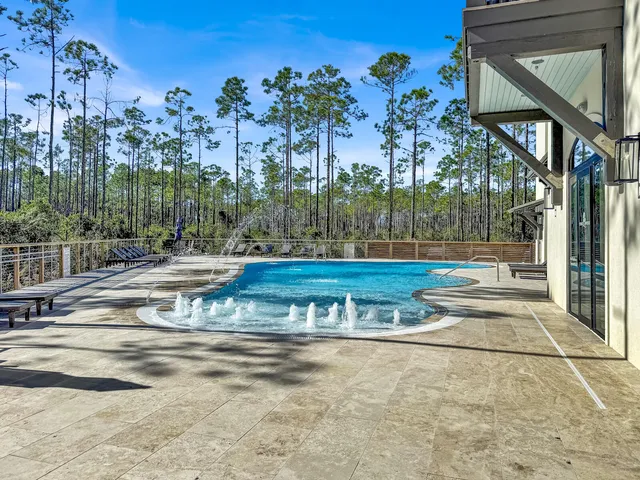 a view of a brick building next to a yard