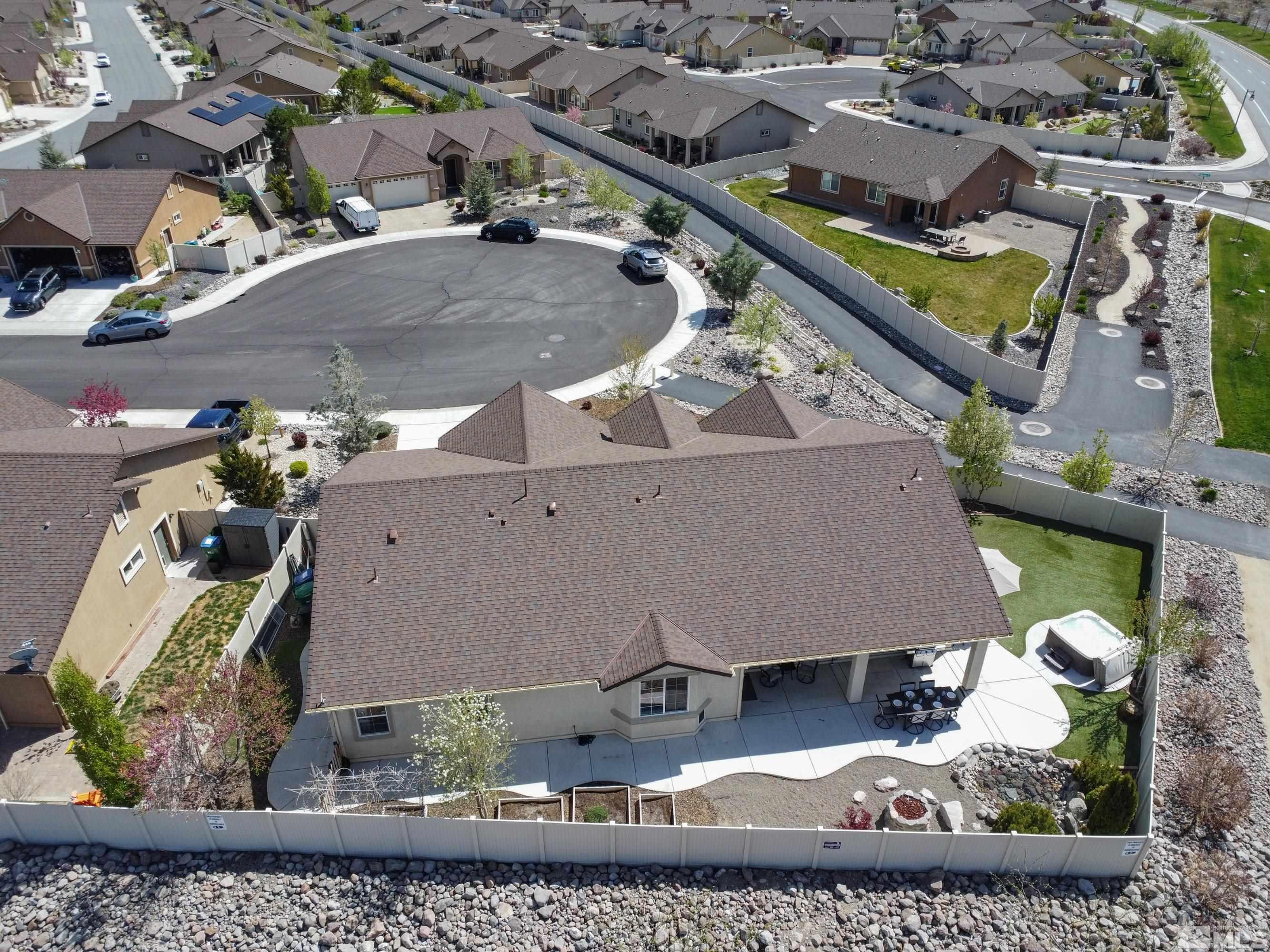 2255 Makenna Drive Reno, NV 89521 - Photo 32 of 34 an aerial view of a house with a garden and fire pit