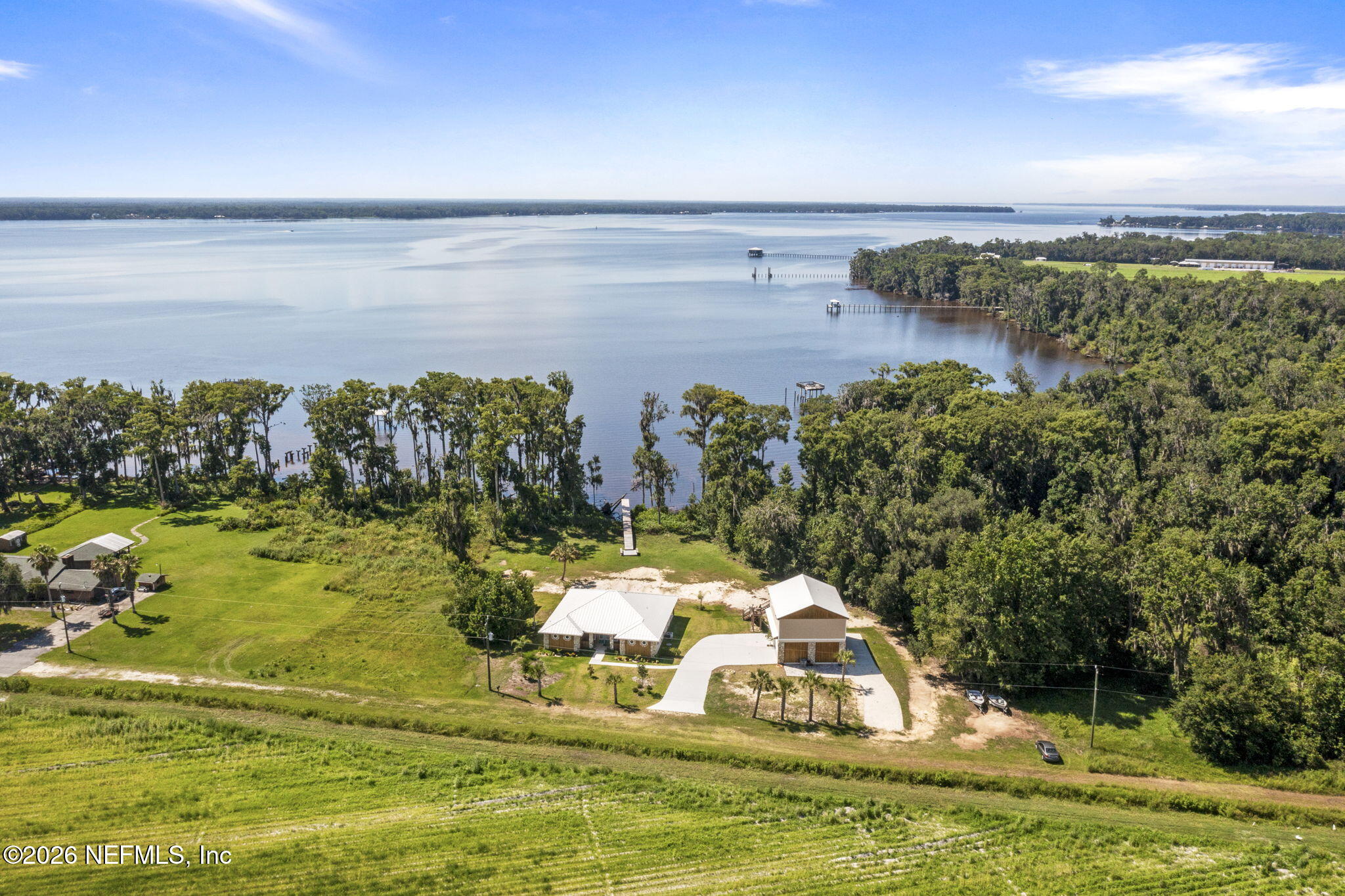 159 Mays Cove Road East Palatka, FL 32131 - Photo 1 of 62 a view of a lake with a nearby beach