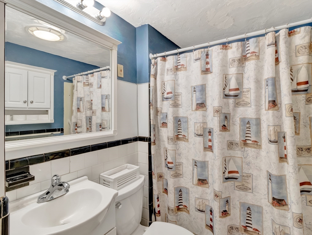 5 G Street Hull, MA 02045 - Photo 24 of 41 a bathroom with a sink and a mirror