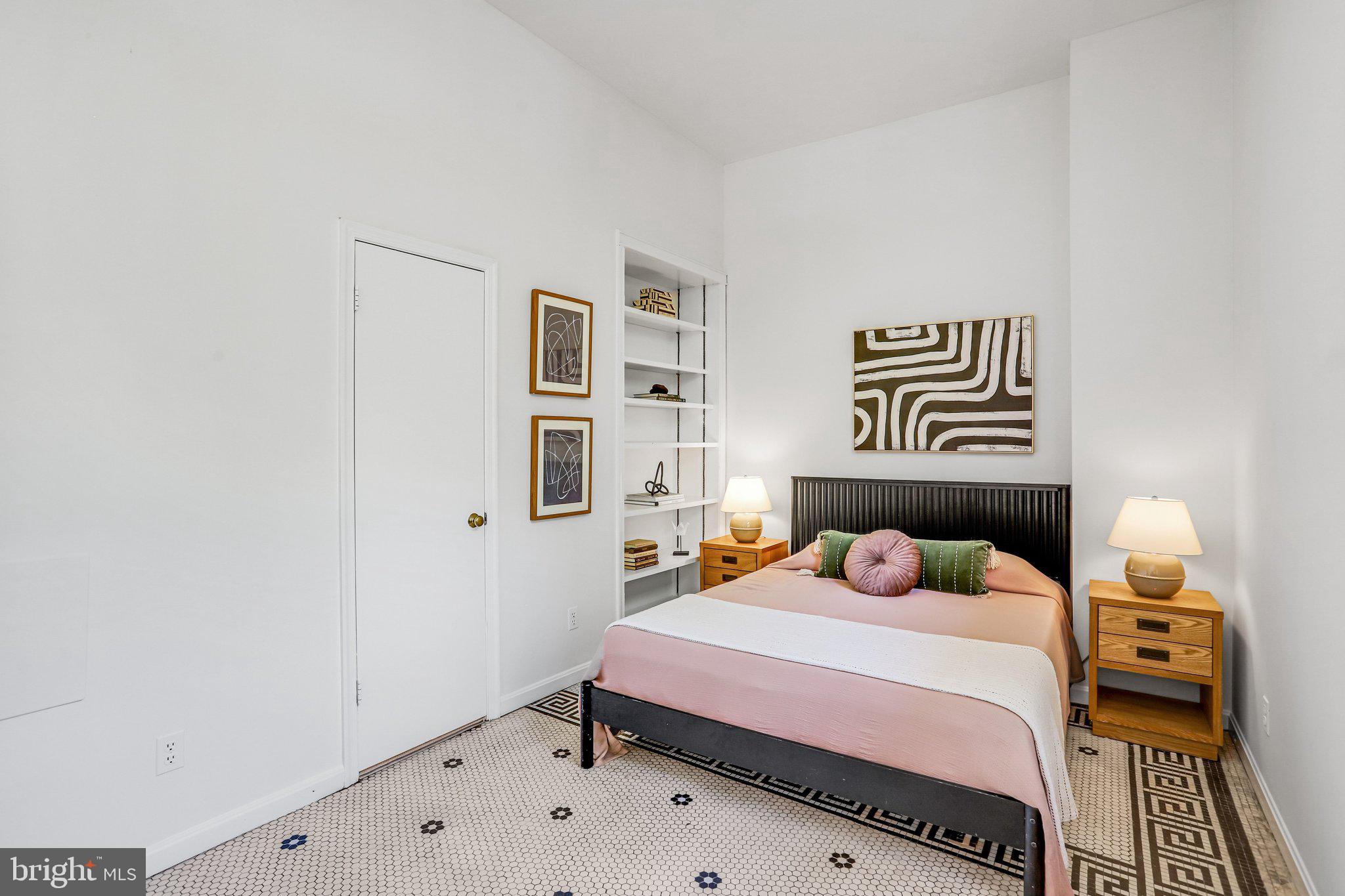 2001 16th Street Northwest, Unit 105 Washington, DC 20009 - Photo 6 of 16 a bedroom with a bed and a window