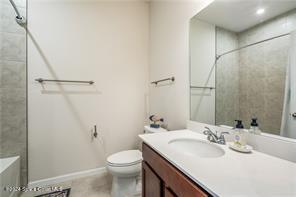 Undisclosed Address Vero Beach, FL 32967 - Photo 25 of 36 a bathroom with a sink toilet and shower