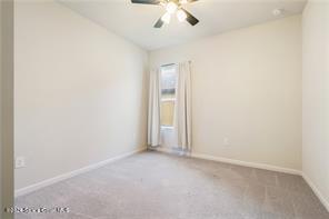 Undisclosed Address Vero Beach, FL 32967 - Photo 26 of 36 an empty room with a chandelier fan