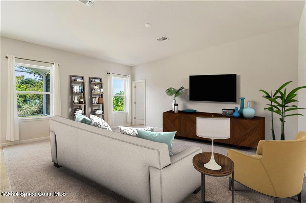 Undisclosed Address Vero Beach, FL 32967 - Photo 4 of 36 a living room with furniture and a flat screen tv