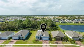 Undisclosed Address Vero Beach, FL 32967 - Photo 5 of 36 an aerial view of a house with a swimming pool