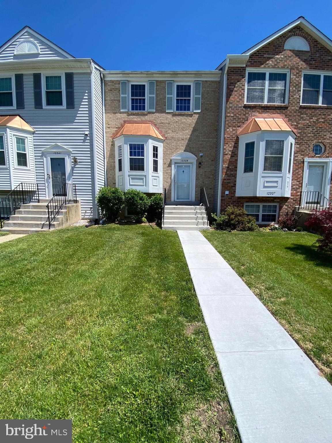 12339 Sandy Point Court Silver Spring, MD 20904 - Photo 1 of 19 a front view of a house with a yard