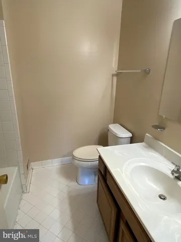 a bathroom with a sink and toilet