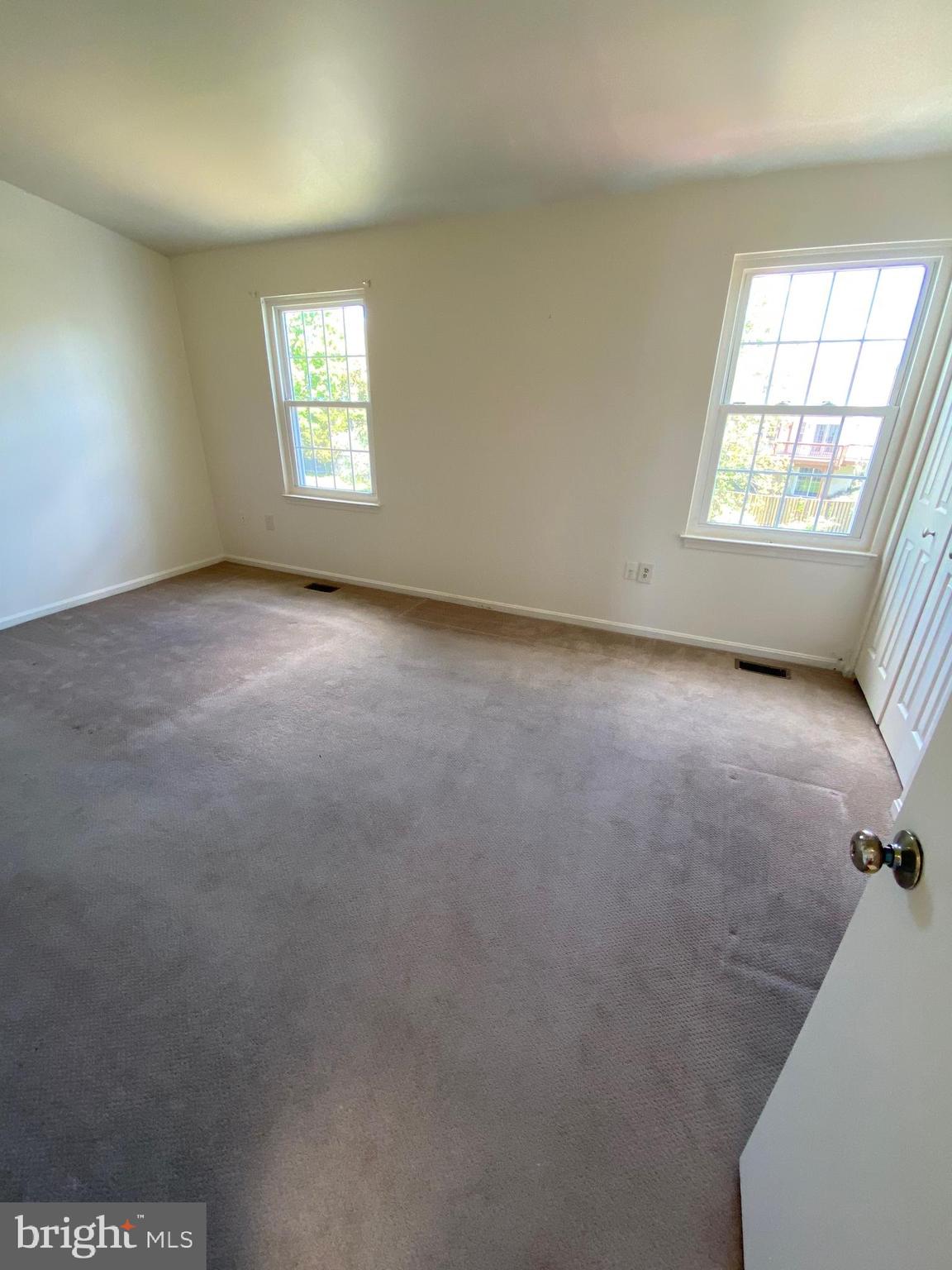 12339 Sandy Point Court Silver Spring, MD 20904 - Photo 8 of 19 an empty room with windows