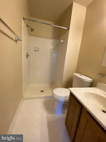 a bathroom with a toilet and shower