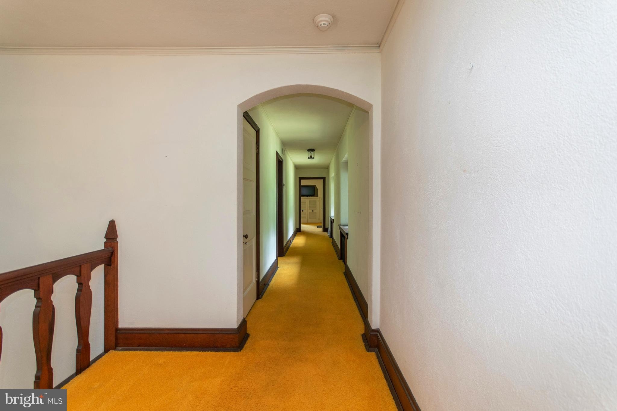 643 Washington Lane Rydal, PA 19046 - Photo 23 of 47 Long hallways w curved archways lead to BR wings