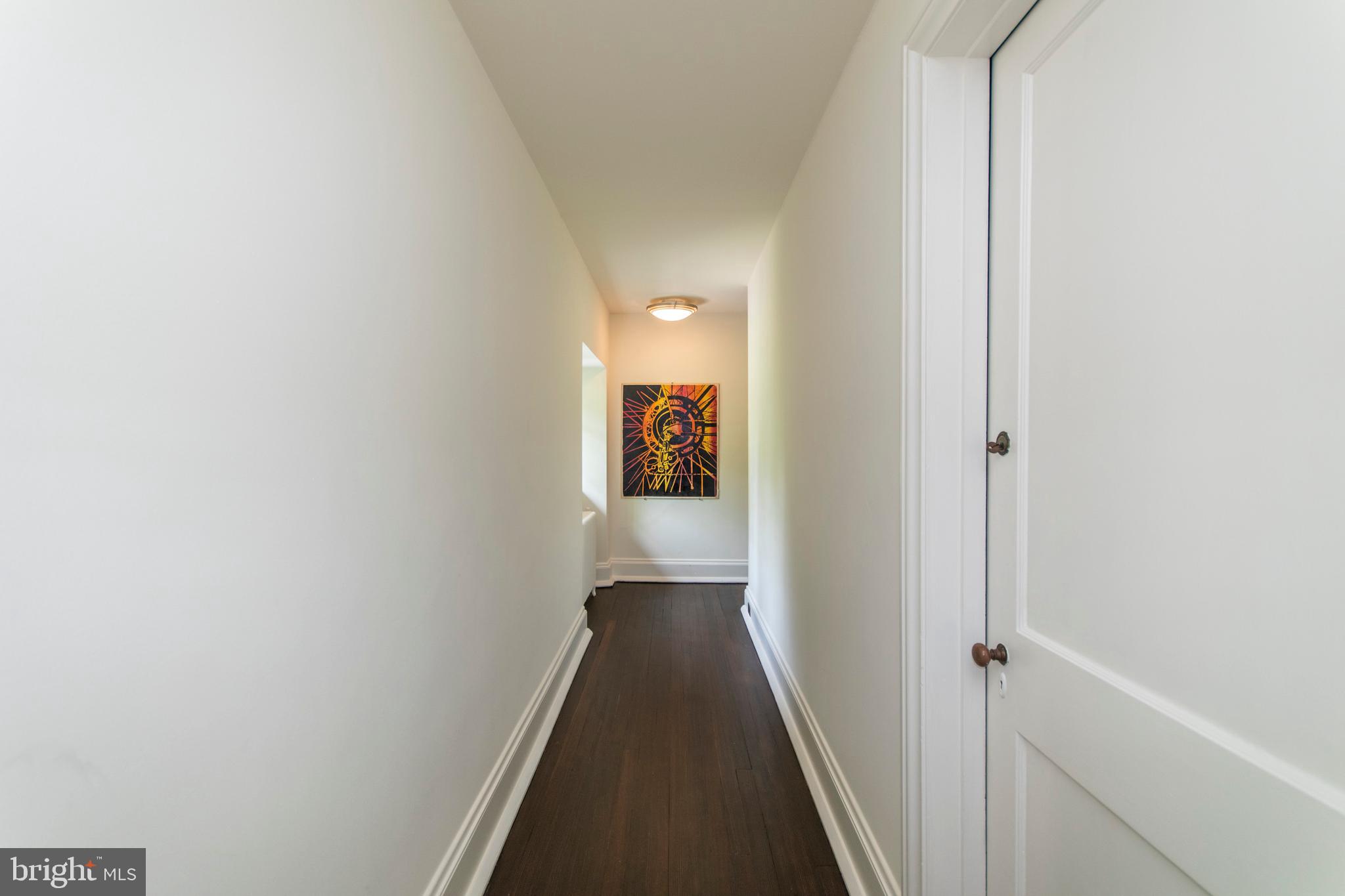 643 Washington Lane Rydal, PA 19046 - Photo 35 of 47 Hallways leads to rear wing of Bedrooms