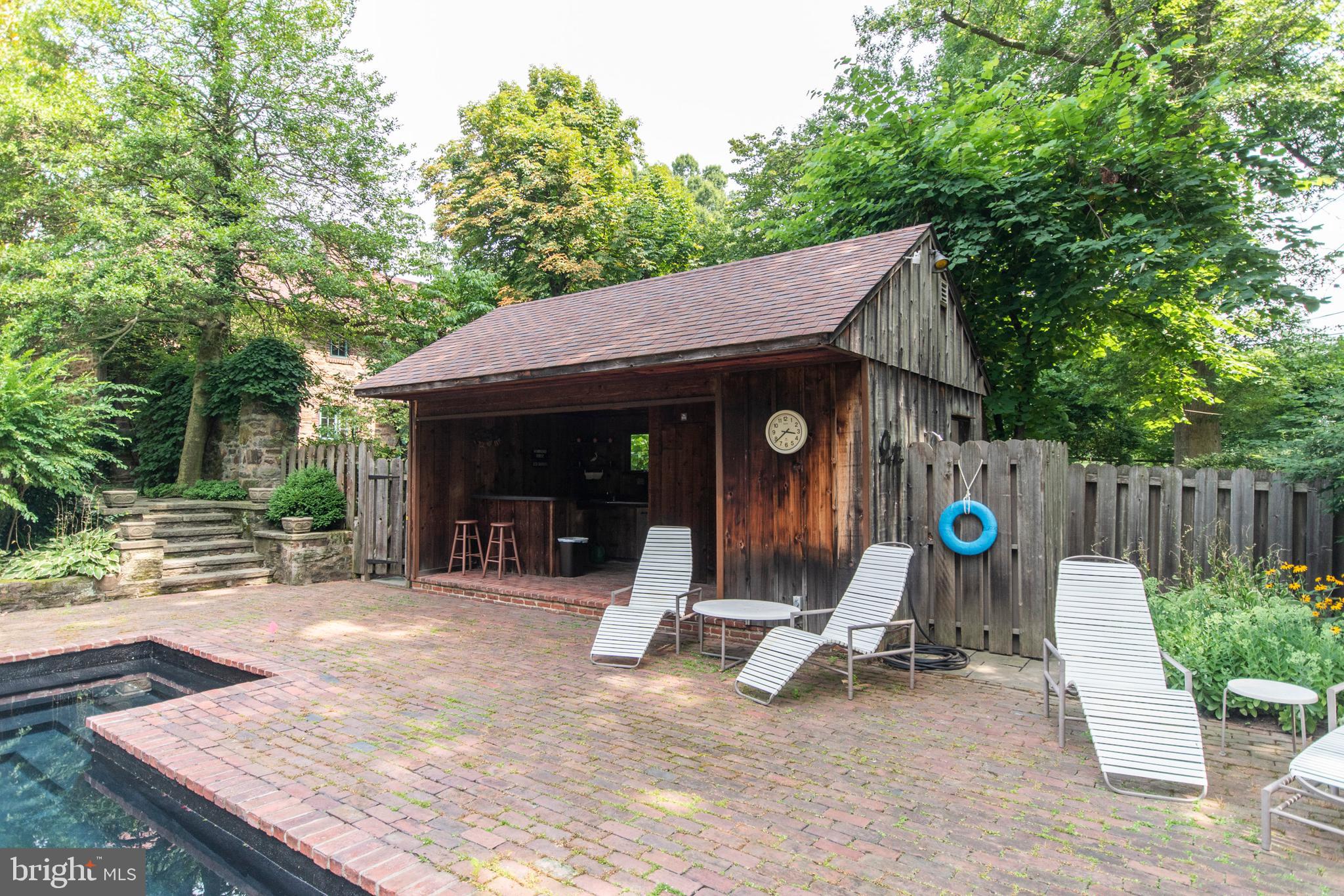 643 Washington Lane Rydal, PA 19046 - Photo 40 of 47 Cabana with bar, bathroom, shower and changing rms