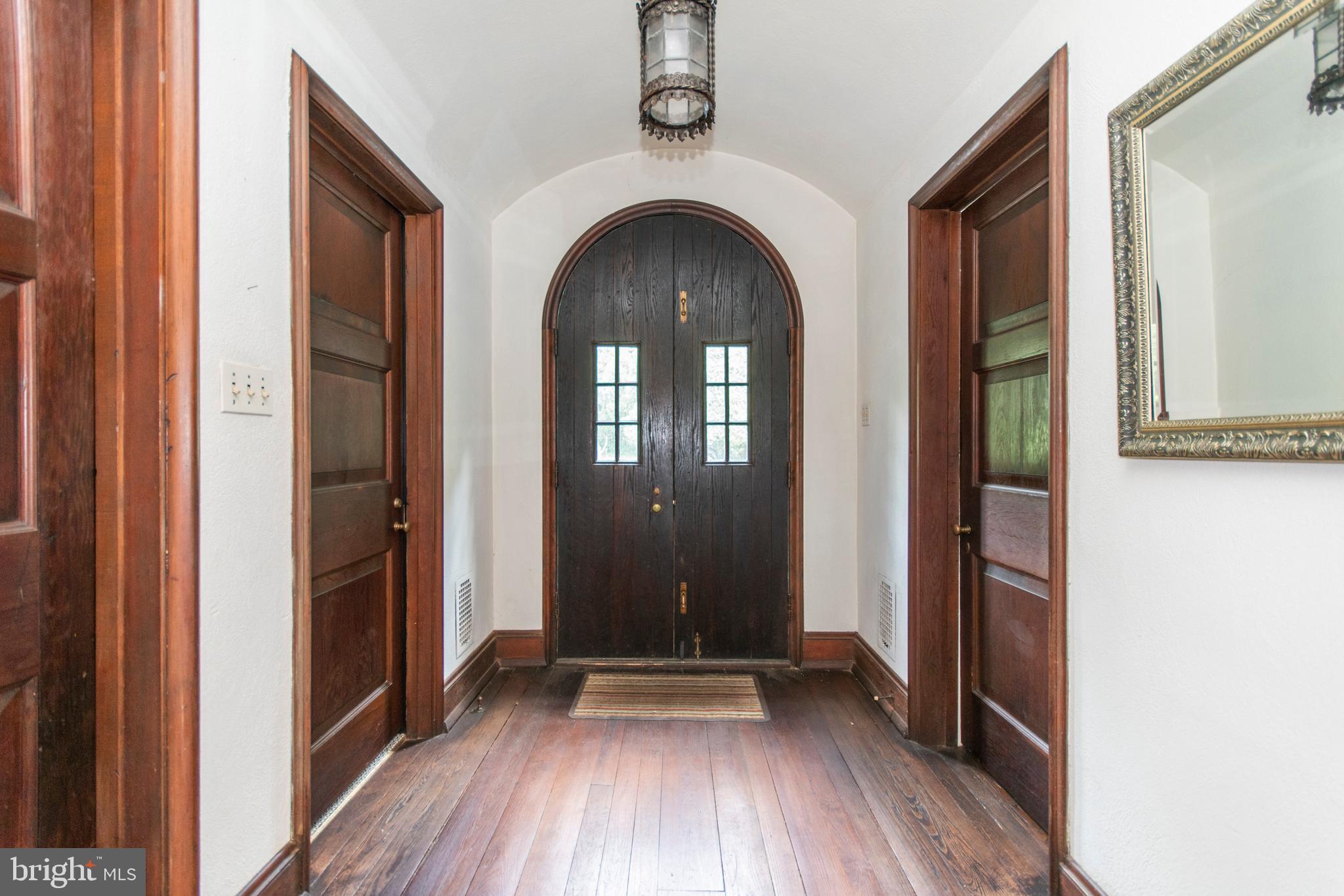 643 Washington Lane Rydal, PA 19046 - Photo 6 of 47 Stately wooden carved door leads to Center Hall