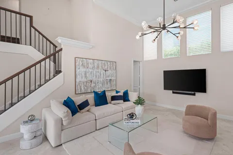 a kitchen with stainless steel appliances white cabinets and a stove top oven