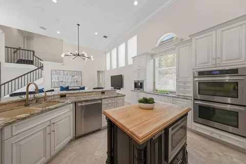 a bathroom with a granite countertop sink mirror and double