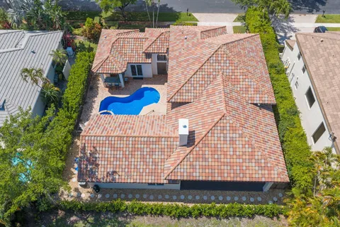 a view of a house with swimming pool and sitting area