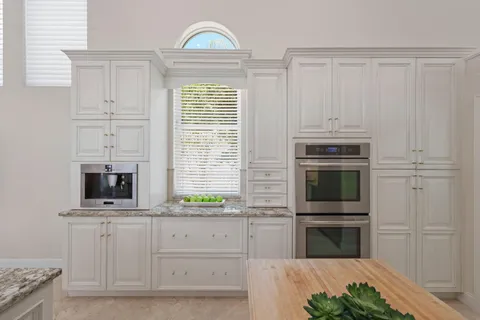 a utility room with sink dryer and washer