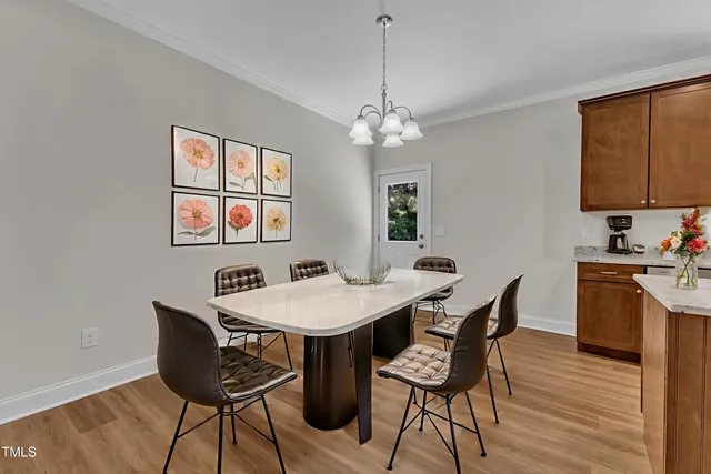 a kitchen with kitchen island granite countertop a sink cabinets and stainless steel appliances