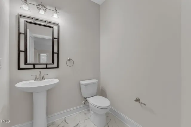 a kitchen with a wooden floor and window