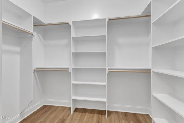 a bathroom with a sink double vanity granite and a mirror