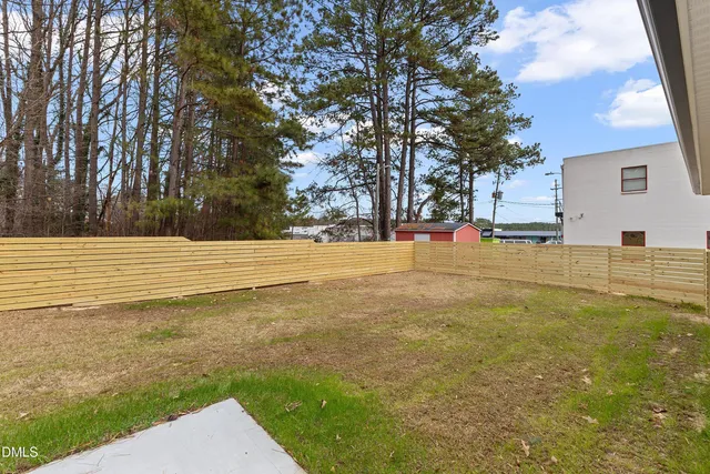 a view of a yard with trees
