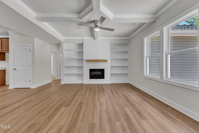 a kitchen with stainless steel appliances granite countertop cabinets sink and wooden floor