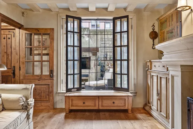 a living room with furniture and large window