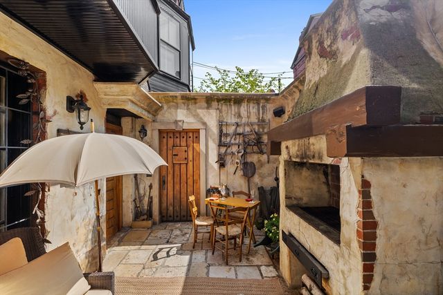 a front view of a multi story building with yard