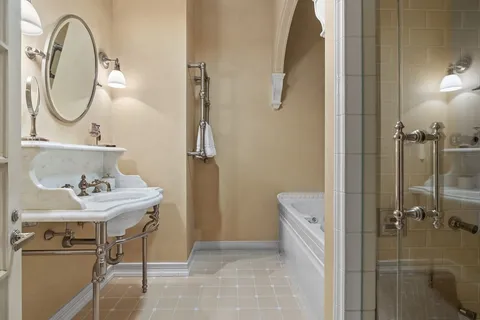 a bathroom with a sink a toilet and a mirror