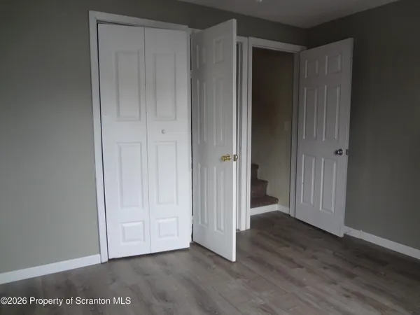 a view of staircase with white walls